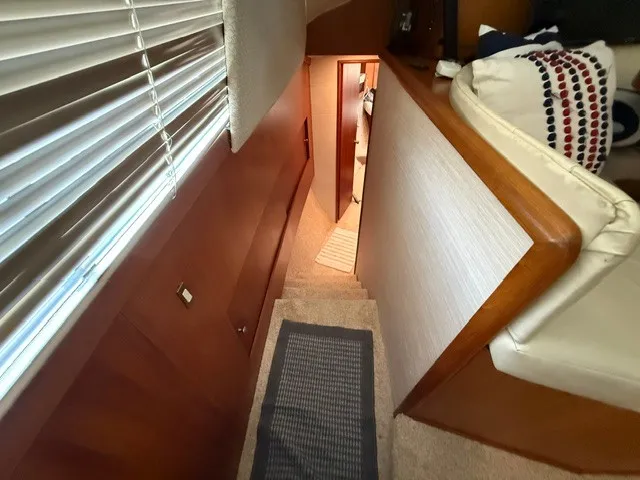 Slide: The Image of Interior of a 1997 Ocean Yachts 40ss with stairs and a cozy seating area. - 12