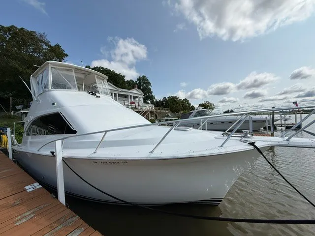 Slide: The Image of 1997 Ocean Yachts 40ss at dock with covered upper deck. - 1