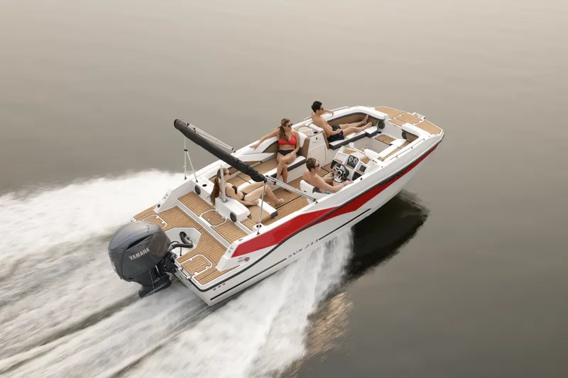 Slide: The Image of A modern Starcraft 211SVXOB boat from 2027 speeds across calm water. - 1
