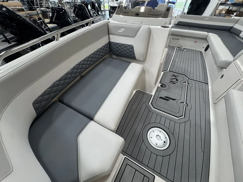 Slide: The Image of The image shows the interior of a 2027 Starcraft 211SVXOB with gray upholstery and flooring. - 32