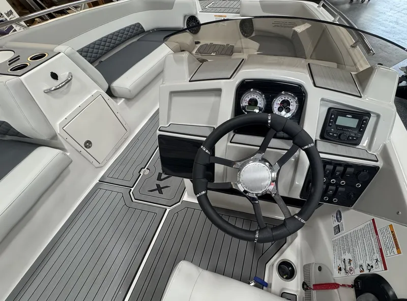 Slide: The Image of The image shows the cockpit of a 2027 Starcraft 211SVXOB with a modern helm station. - 17