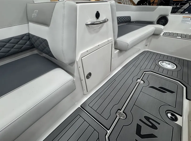 Slide: The Image of Interior of a 2027 Starcraft 211SVXOB with gray upholstery and textured flooring. - 23