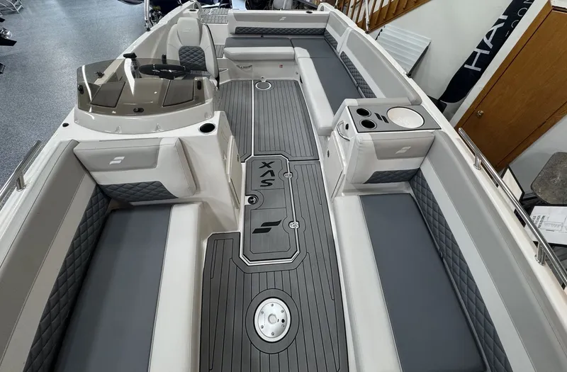 Slide: The Image of The image shows the interior of a 2027 Starcraft 211SVXOB boat with gray upholstery. - 37