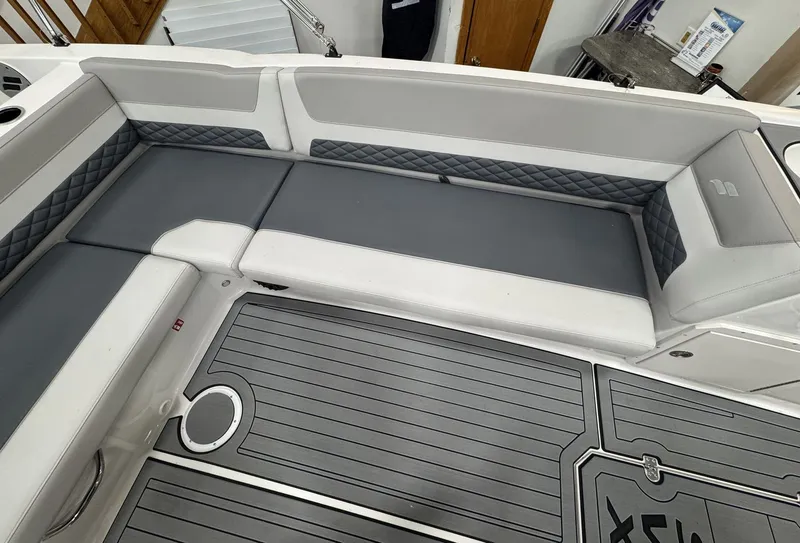 Slide: The Image of The image shows the cockpit of a 2027 Starcraft 211SVXOB with gray and white upholstery. - 12