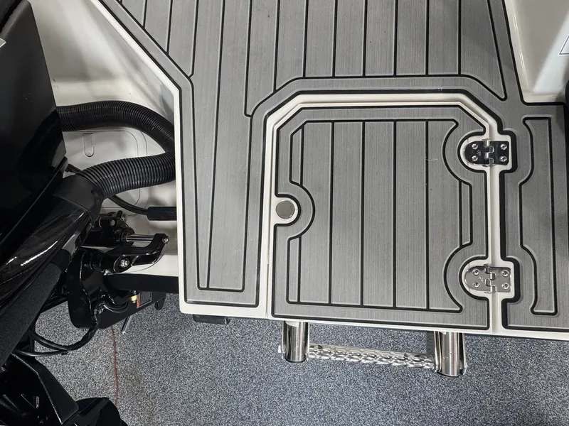 Slide: The Image of The image shows the deck of a 2027 Starcraft 211SVXOB with gray, textured flooring. - 4