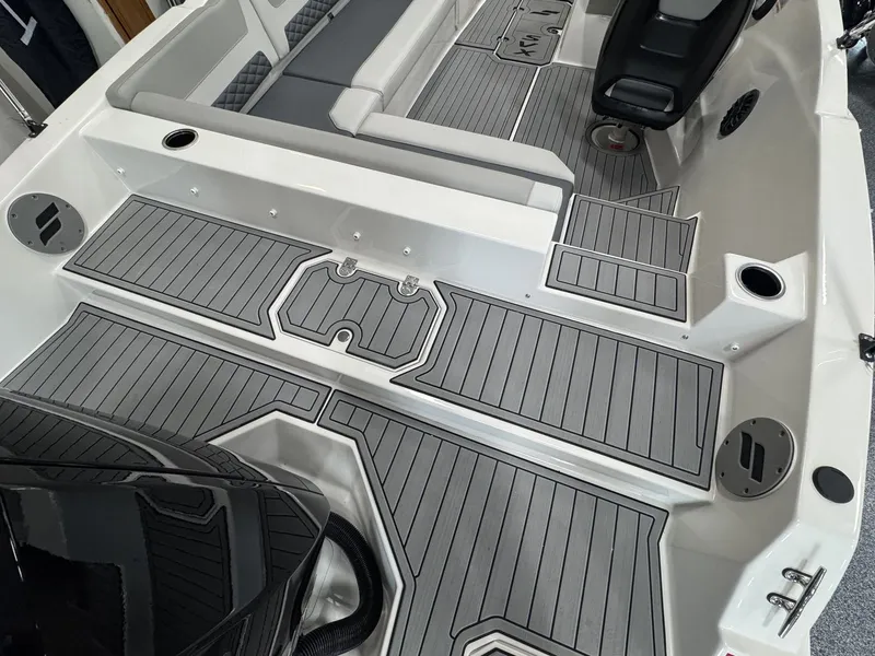 Slide: The Image of The image shows the cockpit of a 2027 Starcraft 211SVXOB with gray flooring and seating. - 6