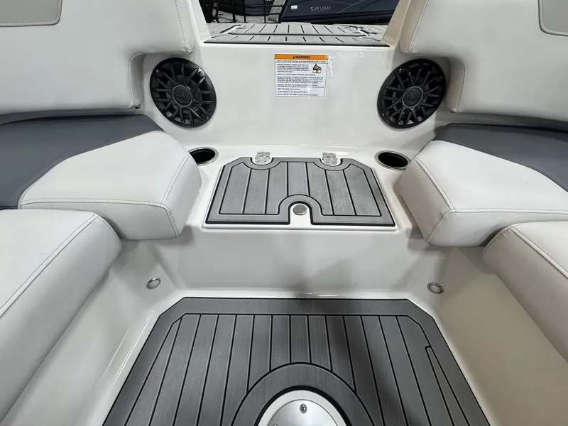 Slide: The Image of Interior view of a 2027 Starcraft 211SVXOB with gray and white seating and speakers. - 33