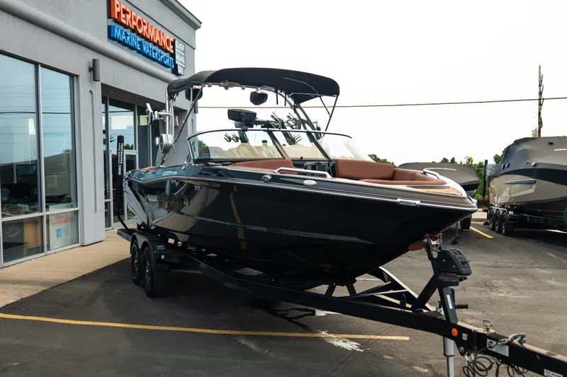 Slide: The Image of 2020 MasterCraft XT25 boat on trailer outside Performance Marine Watersports dealership. - 12