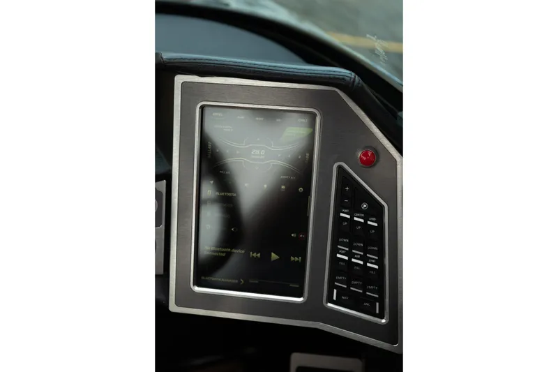 Slide: The Image of 2020 MasterCraft XT25 dashboard with touchscreen controls and navigation buttons. - 22