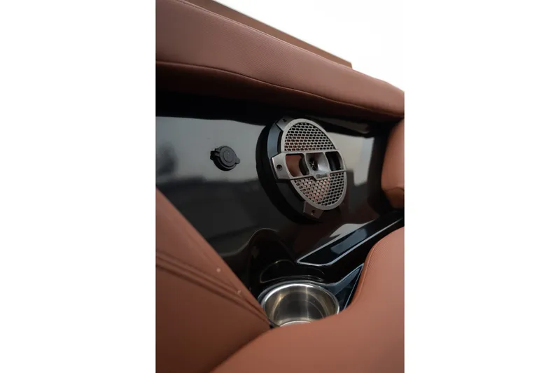 Slide: The Image of Interior of 2020 MasterCraft XT25 boat featuring speaker and cup holder. - 17