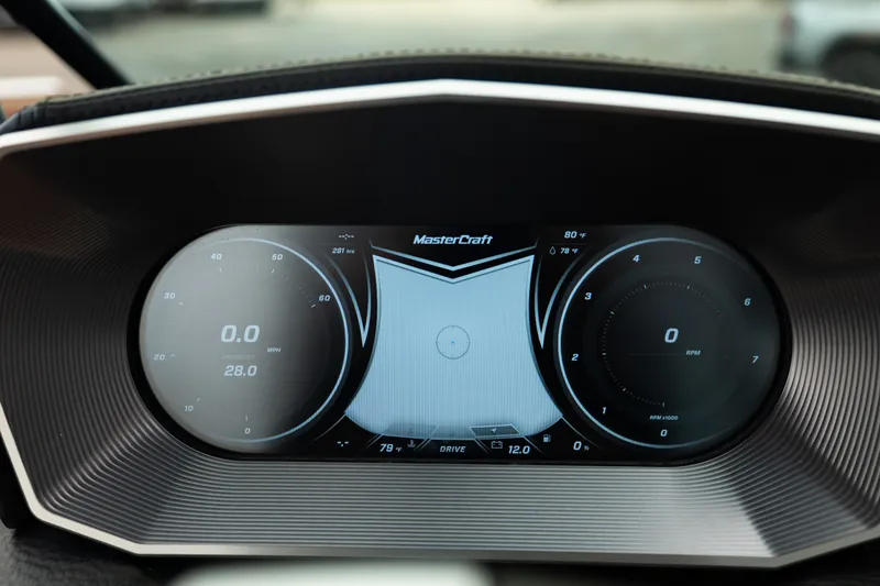 Slide: The Image of Digital dashboard of 2020 MasterCraft XT25 boat displaying speed and RPM gauges. - 21