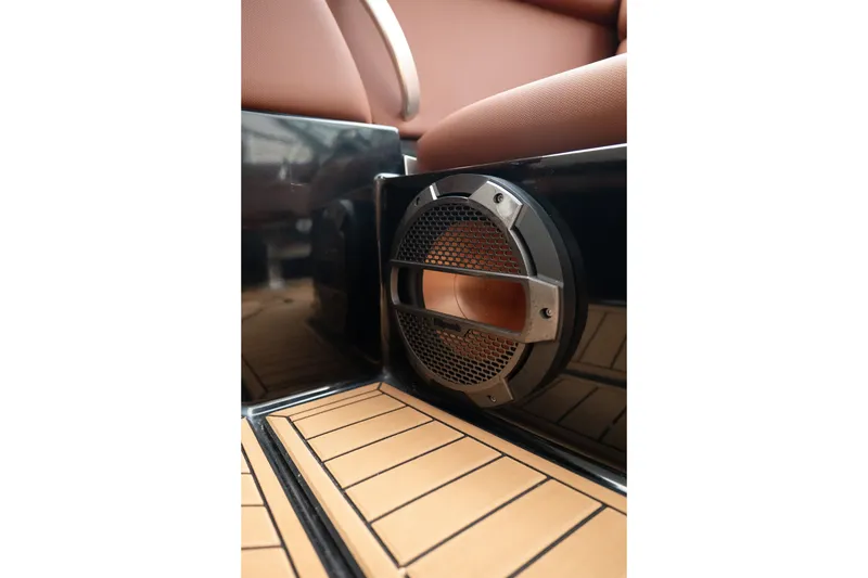 Slide: The Image of Speaker detail in 2020 MasterCraft XT25 boat interior with teak flooring. - 27