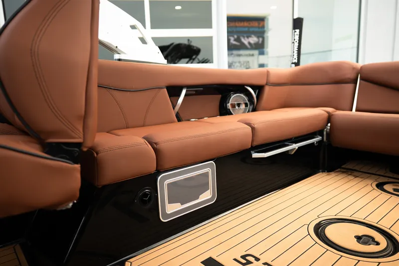 Slide: The Image of Luxurious interior of 2020 MasterCraft XT25 boat with brown leather seating and sleek design. - 29
