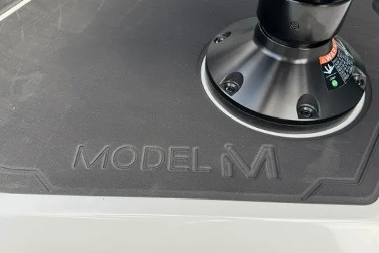 Slide: The Image of Alera M25Q 2027 Model M base with textured surface and mounting component. - 44