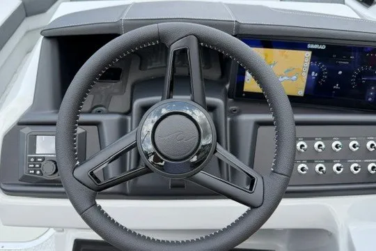 Slide: The Image of Steering wheel and dashboard of 2027 Alera M25Q boat with navigation display. - 40