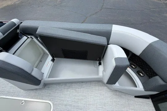 Slide: The Image of 2027 Alera M25Q boat seating with storage compartments and cup holders. - 67