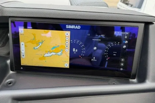 Slide: The Image of Simrad navigation display in 2027 Alera M25Q, showing map and speedometer. - 38