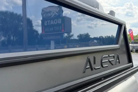 Slide: The Image of 2027 Alera M25Q vehicle with sleek design and reflective surface. - 9