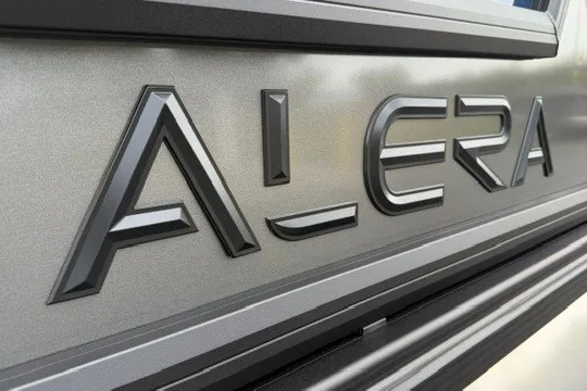Slide: The Image of 2027 Alera M25Q logo on metallic surface, close-up view. - 10