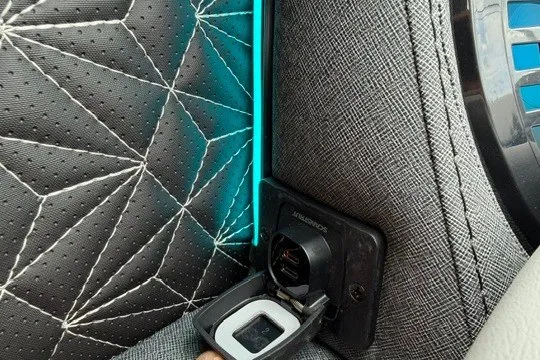 Slide: The Image of Interior of Alera M25Q 2027 car with illuminated stitching and power outlet. - 32