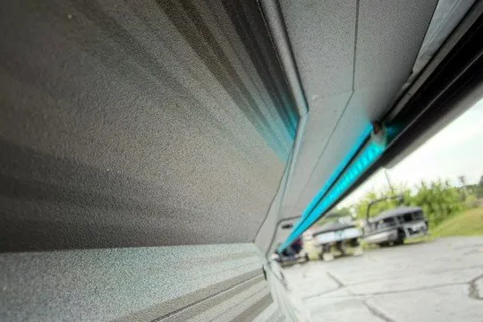 Slide: The Image of Alera M25Q 2027 vehicle exterior with sleek design and vibrant blue accent lighting. - 4