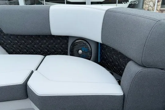 Slide: The Image of Gray and white seating on 2027 Alera M25Q boat, featuring modern design and speaker integration. - 29