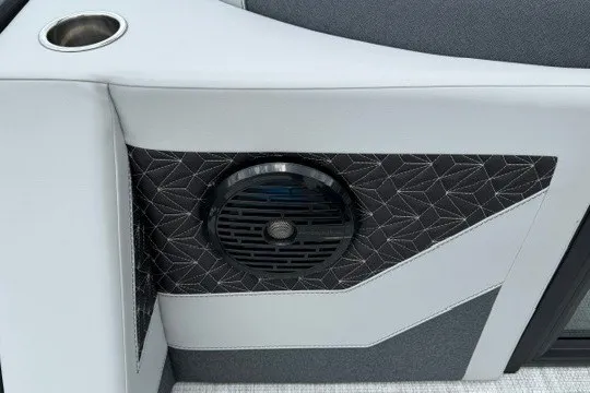 Slide: The Image of Alera M25Q 2027 boat interior with speaker and cup holder detail. - 25