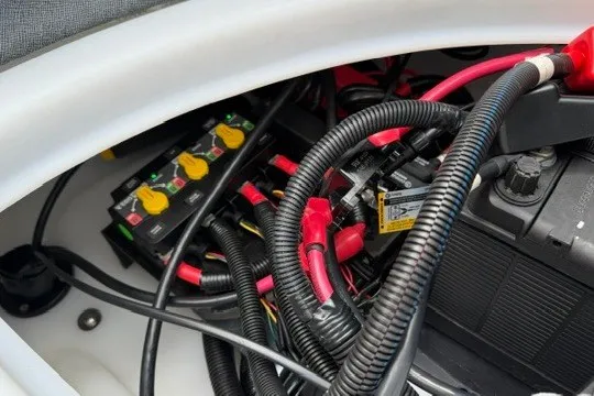 Slide: The Image of Electrical wiring and components inside Alera M25Q, 2027 model. - 79