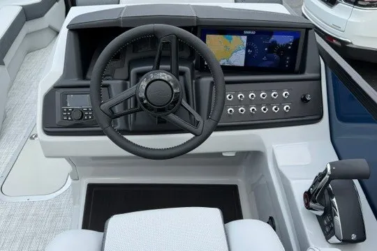 Slide: The Image of Steering console of 2027 Alera M25Q boat with navigation display and controls. - 37