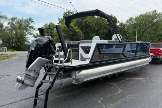 Slide: The Image of 2027 Alera M25Q pontoon boat with sleek design and powerful outboard motor. - 15