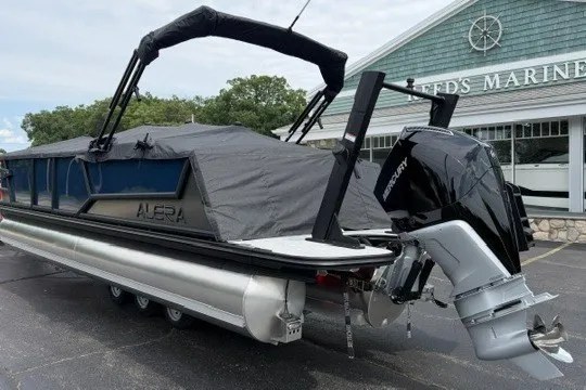 Slide: The Image of 2027 Alera M25Q pontoon boat with cover and Mercury outboard motor at marina. - 85