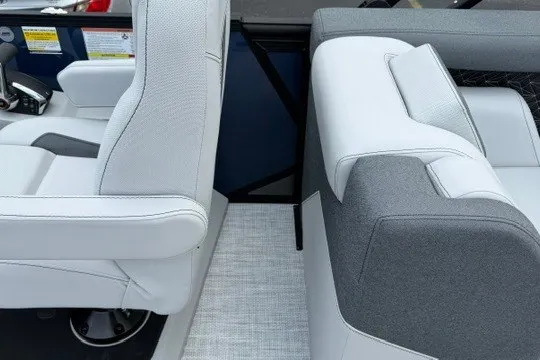 Slide: The Image of Interior seating of 2027 Alera M25Q boat, featuring modern white and gray upholstery. - 35