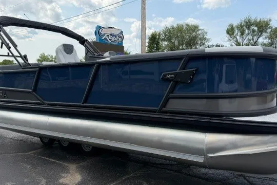 Slide: The Image of Alera M25Q 2027 pontoon boat with sleek blue design and modern features. - 16