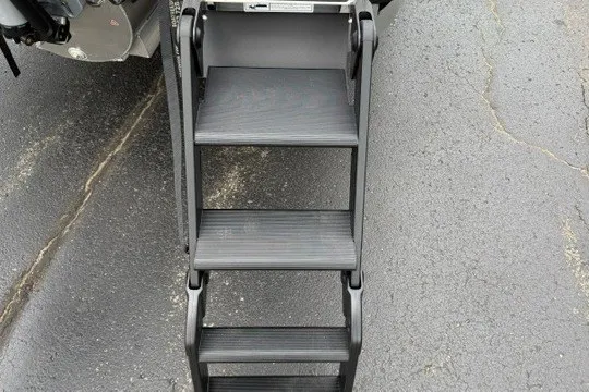 Slide: The Image of Sturdy black metal steps of Alera M25Q 2027 on asphalt surface. - 18