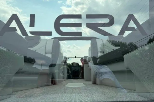 Slide: The Image of Alera M25Q 2027 boat interior with plush seating and open sky view. - 7