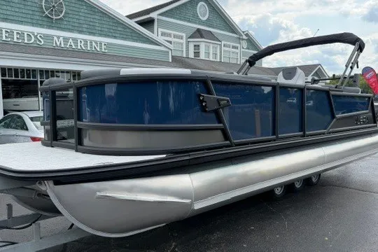 The Image of 2027 Alera M25Q pontoon boat displayed at a marina, showcasing sleek design and modern features. - 1