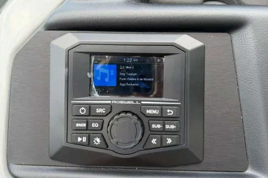 Slide: The Image of Dashboard audio system in a 2027 Alera M25Q with digital display and control buttons. - 42