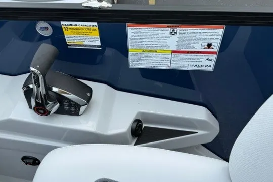 Slide: The Image of Control panel of 2027 Alera M25Q boat with capacity warning labels. - 36