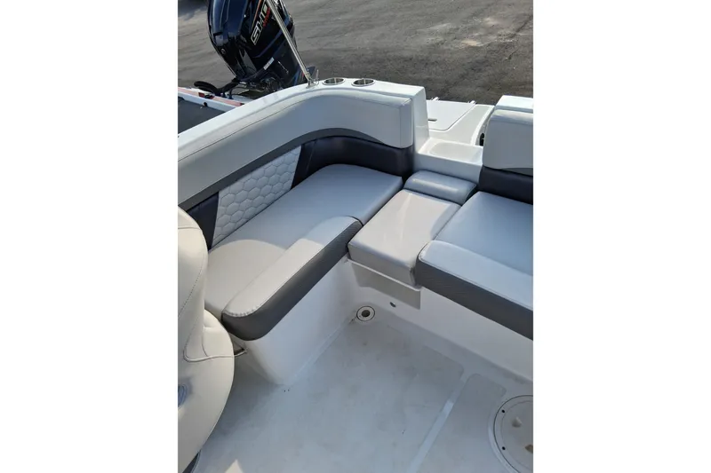 Slide: The Image of 2024 Hurricane SunDeck 191 OB boat interior with cushioned seating and modern design. - 14