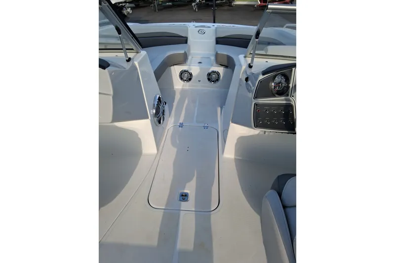 Slide: The Image of 2024 Hurricane SunDeck 191 OB boat interior with dashboard and seating area. - 18