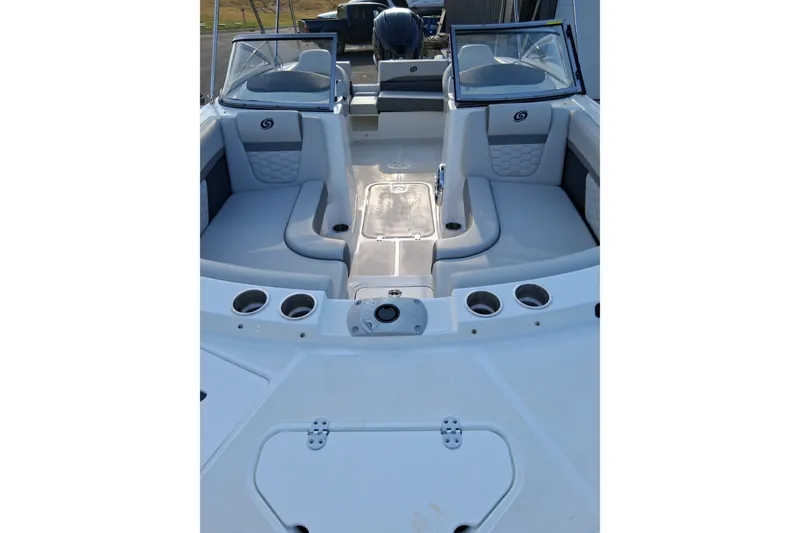 Slide: The Image of 2024 Hurricane SunDeck 191 OB boat interior with seating and cup holders. - 20