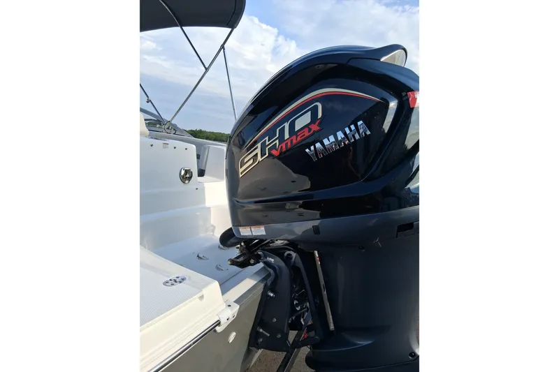 Slide: The Image of 2024 Hurricane SunDeck 191 OB with Yamaha SHO Max outboard motor, under a clear sky. - 4