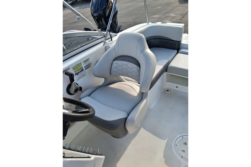 Slide: The Image of 2024 Hurricane SunDeck 191 OB boat interior with comfortable seating and modern design. - 12