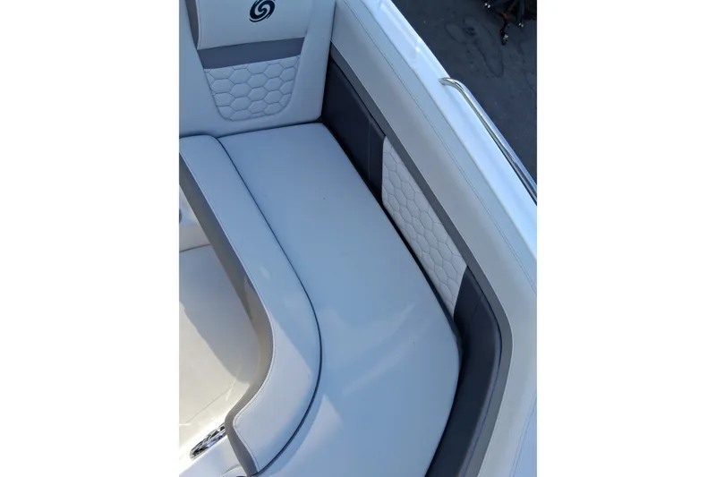 Slide: The Image of 2024 Hurricane SunDeck 191 OB boat interior with cushioned seating and stylish design. - 9