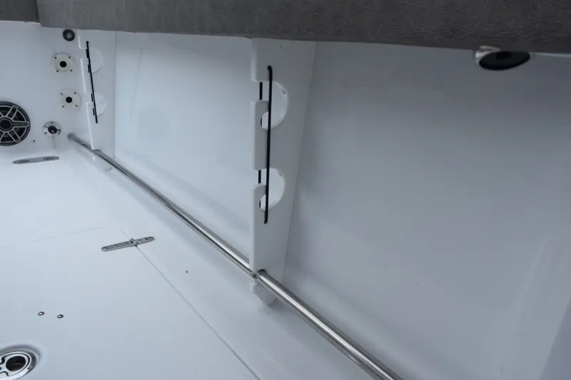 Slide: The Image of Interior view of 2027 Sea Hunt Gamefish 28CB boat, featuring rod holders and speaker. - 17