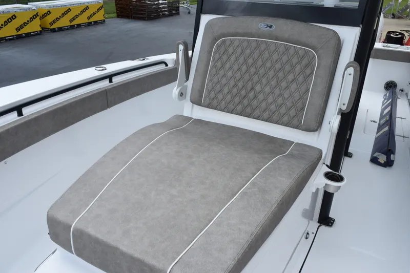 Slide: The Image of 2027 Sea Hunt Gamefish 28CB boat with luxurious gray seating and cup holder. - 16