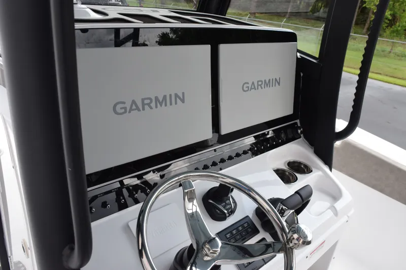Slide: The Image of Steering console of 2027 Sea Hunt Gamefish 28CB with dual Garmin displays. - 18