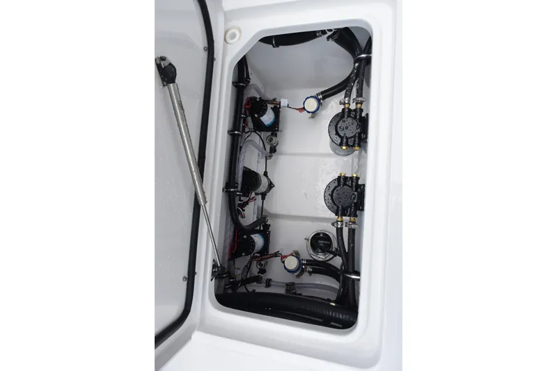 Slide: The Image of Sea Hunt Gamefish 28CB 2027 boat compartment with pumps and wiring. - 26