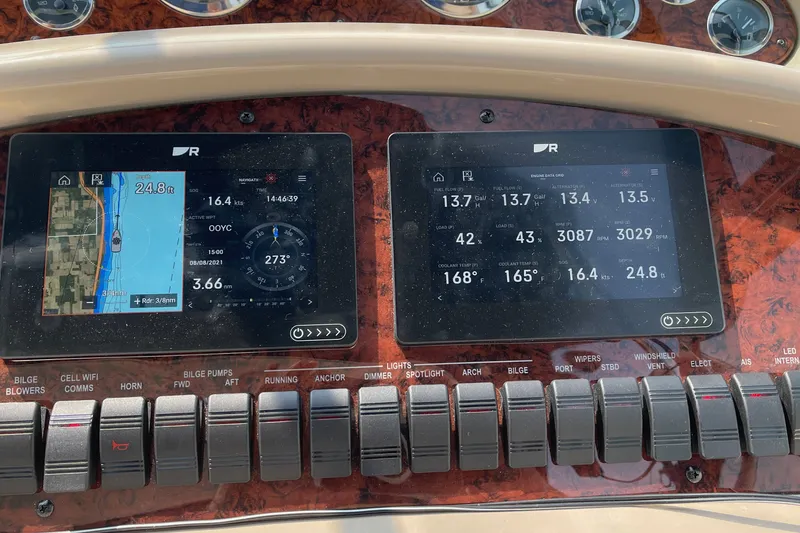 Slide: The Image of Dashboard of a 2000 Sea Ray 380 Sundancer with navigation and engine data displays. - 17