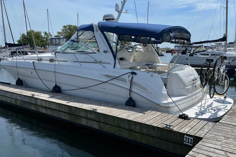 Slide: The Image of 2000 Sea Ray 380 Sundancer yacht docked at marina with bicycles attached. - 33